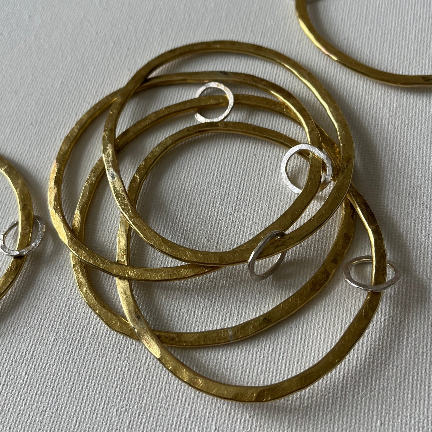 Hammered Brass Bangle with Oval Eco-Silver Charm
