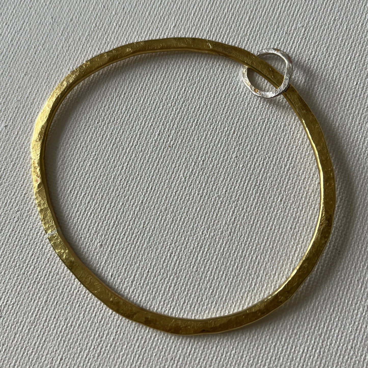 Hammered Brass Bangle with Oval Eco-Silver Charm