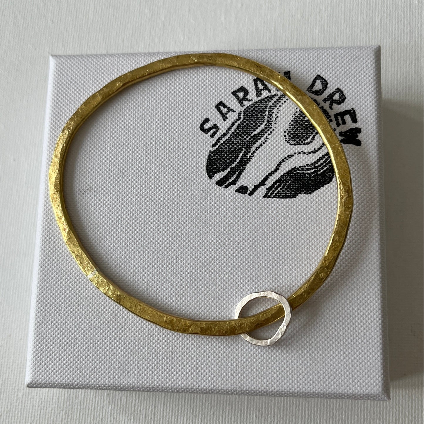 Hammered Brass Bangle with Oval Eco-Silver Charm